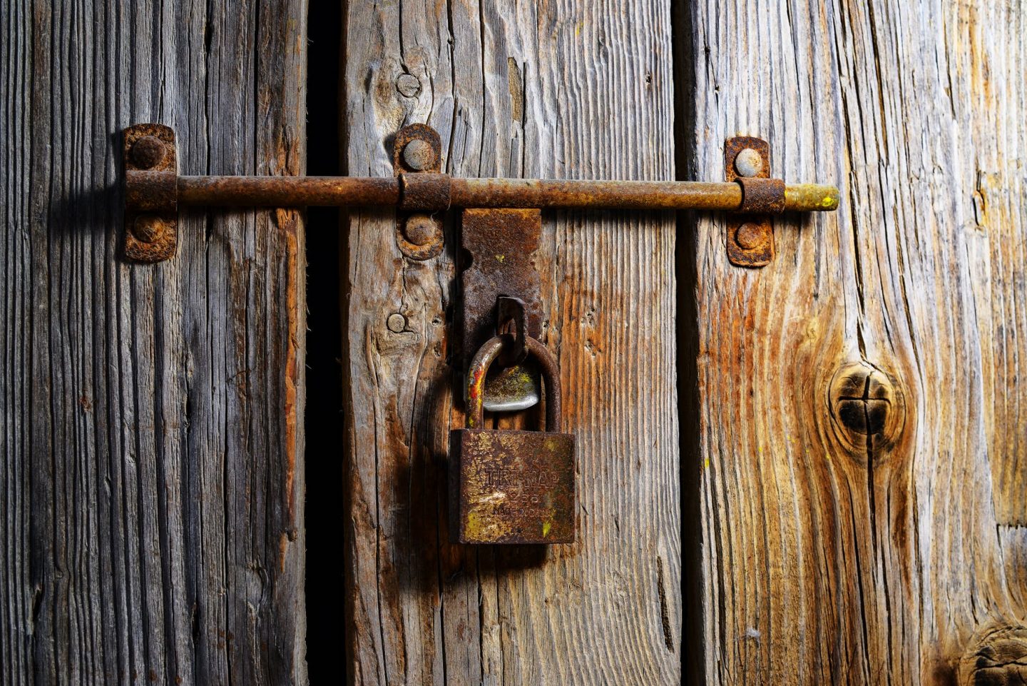 brown padlock on wall